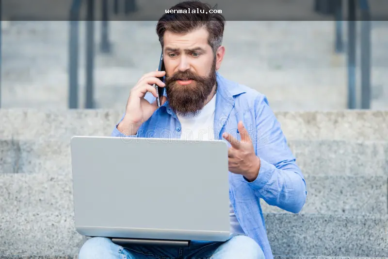 A person checking an online betting platform on a mobile phone with security indicators in view